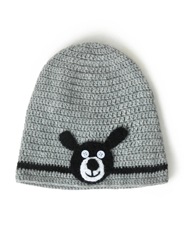 Bold Bear Design: A playful black bear applique with a happy face brings a fun and friendly vibe to winter outfits