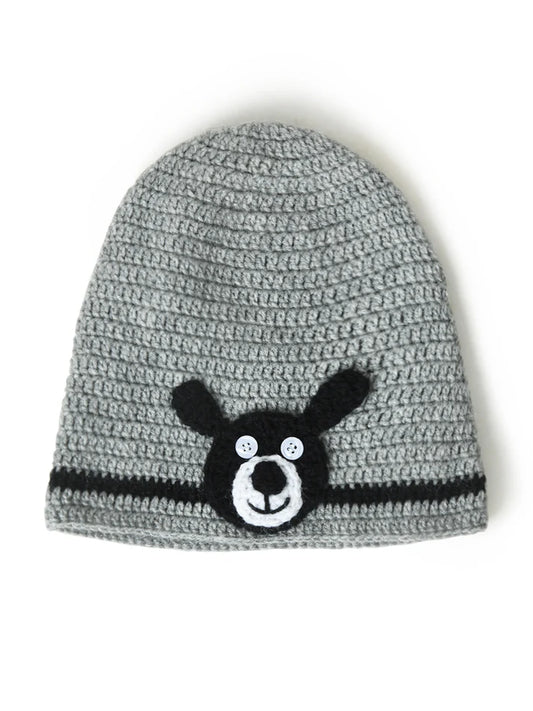 Bold Bear Design: A playful black bear applique with a happy face brings a fun and friendly vibe to winter outfits