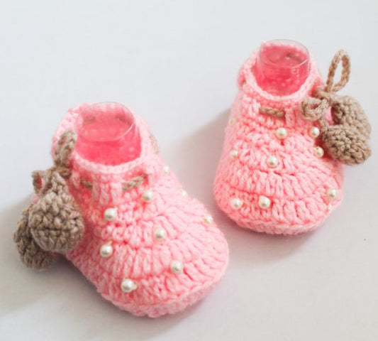 A pair of  pearl detailed booties